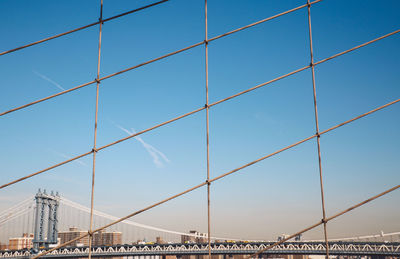 Low angle view of manhattan bridge against sky