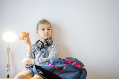 Portrait of girl holding camera