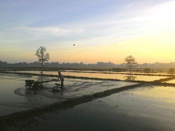 Scenic view of landscape against sky during winter