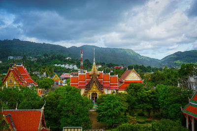 High angle view of trees and buildings against sky