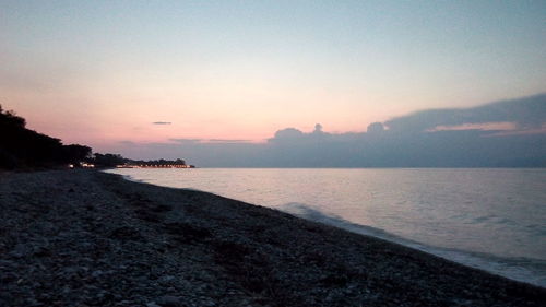 Scenic view of sea against clear sky during sunset