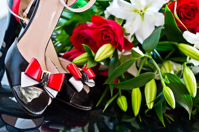 Close up of red flowers and shoes