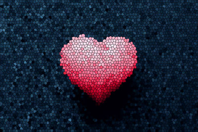 Close-up of heart shape on black background