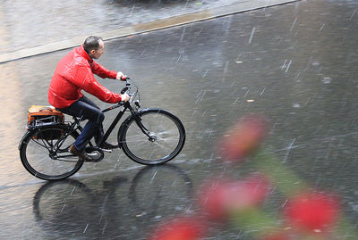 Man riding bicycle on road