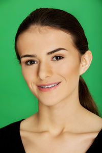 Close-up portrait of a smiling young woman