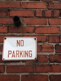 Information sign on brick wall