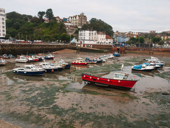 Boats moored at harbor