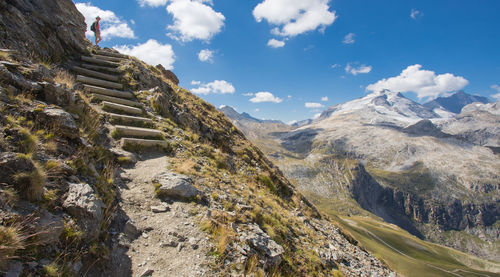 Hike on an aerial path with a view of the grande motte,a summit of the vanoise massif in savoie.