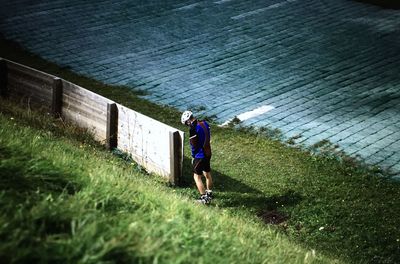 Full length of man standing on grassy field