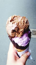 Cropped hand of woman holding ice cream