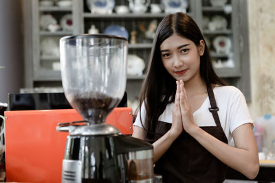 Portrait of woman holding drink