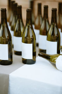 Close-up of wine bottles on table