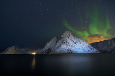 Scenic view of sea against sky at night norway
