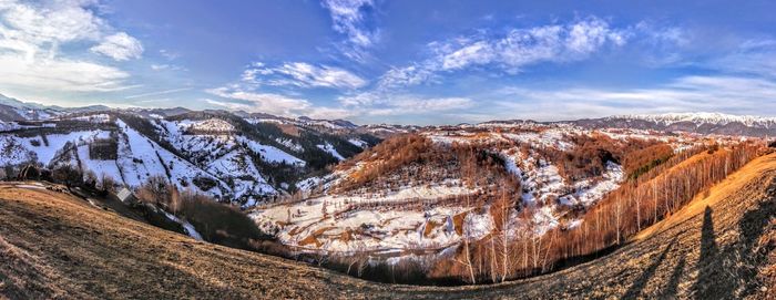 Panoramic view of landscape against sky during winter