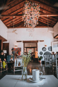Potted plants on table in restaurant