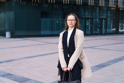 Female portrait of a business woman wearing glasses at the business center