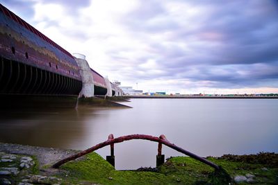 Bridge over river against sky