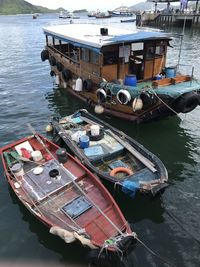 High angle view of fishing boats moored at harbor