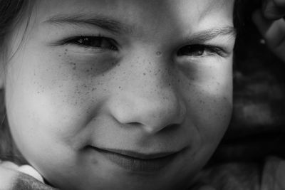 Close-up portrait of smiling girl 