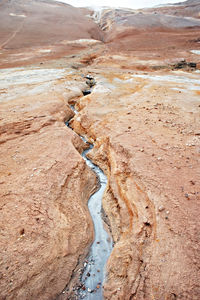 Hverir geothermal area in of iceland, volcano cracked red ground, alternative energy, namafjall