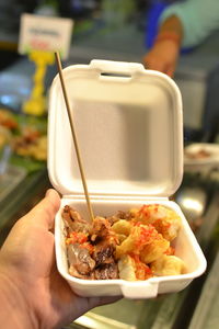 Close-up of hand holding food