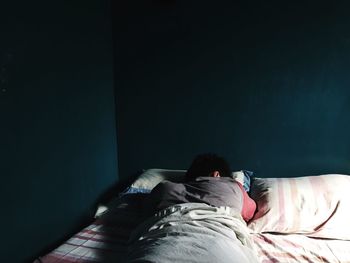 Woman sleeping on bed