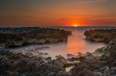 Scenic view of sea against sky during sunset