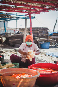 Woman working at food market