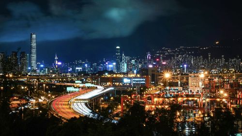 High angle view of illuminated buildings in city at night