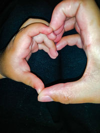 Close-up of couple holding hands