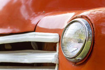 Close-up of red vintage car