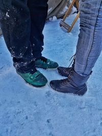 Low section of people on snow