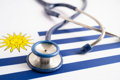 Close-up of stethoscope against blue background