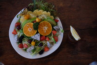 High angle view of fruits in plate on table