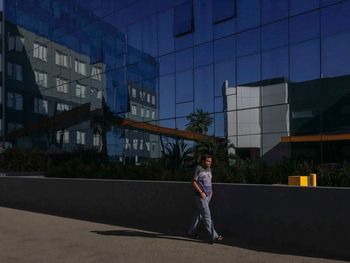 Woman standing in front of building