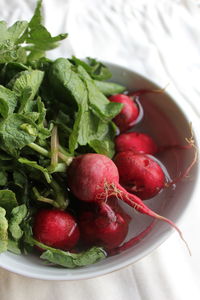 High angle view of strawberries in bowl on table