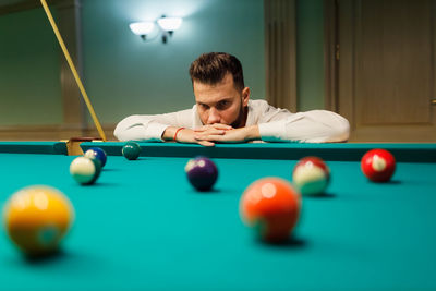 Boy playing pool