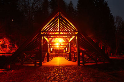 Illuminated suspension bridge at night