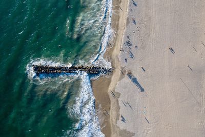 High angle view of surf on beach