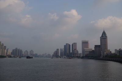 Panoramic view of sea and buildings against sky