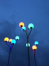 Low angle view of balloons against blue sky