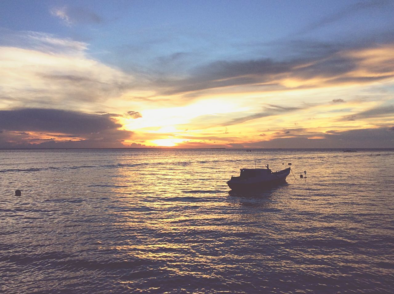 SCENIC VIEW OF SEA AGAINST ORANGE SKY