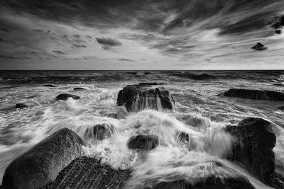 Scenic view of sea against cloudy sky