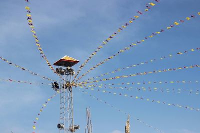 Low angle view of ferris wheel against sky