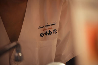 Close-up of hand holding text