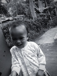 Portrait of cute baby boy outdoors