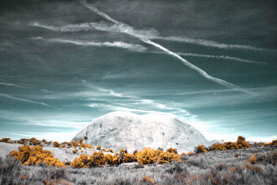 Scenic view of land against sky during winter