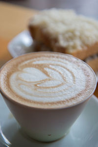 Close-up of cappuccino on table