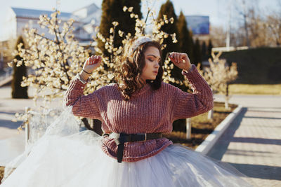 Young woman sitting outdoors