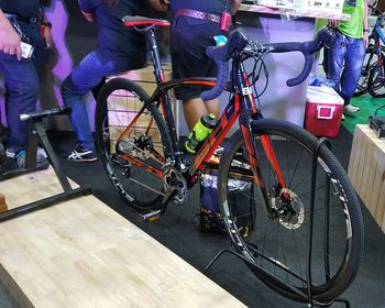 Close-up of bicycles parked against blurred background